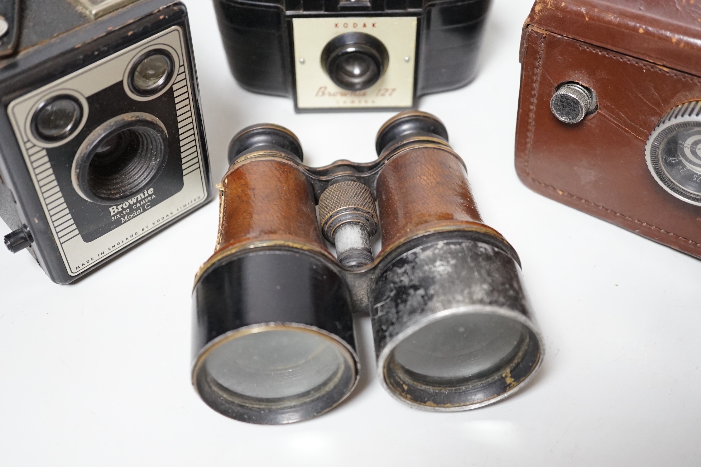 A quantity of camera equipment and a pair of military binoculars